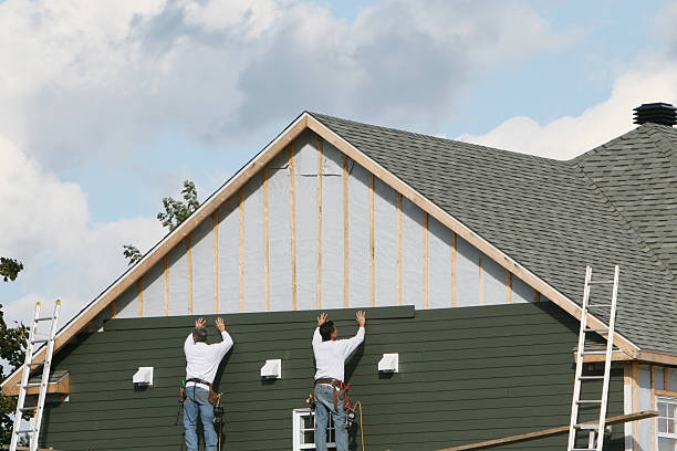 Professional Siding Installation technician working in Greenlawn, NY